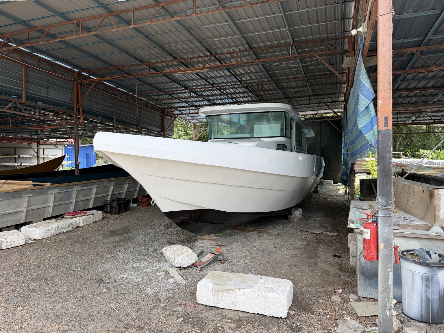 Finished LUXMARINE vessel viewed head-on in the boatyard